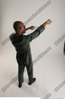 ERIC STANDING POSE WITH GUNS